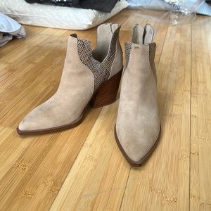 Pointed toe ankle bootie with snakeskin accent around ankle